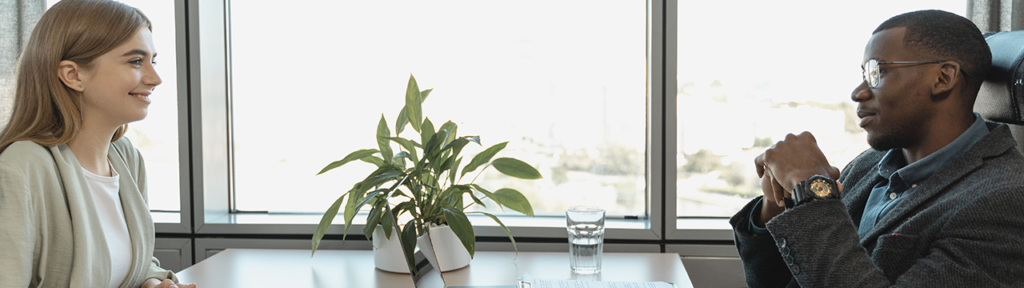 Young woman and man in a business meeting in an office
